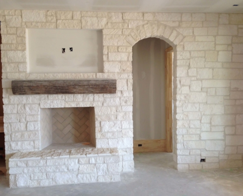 indoor decorative brick wall and fireplace